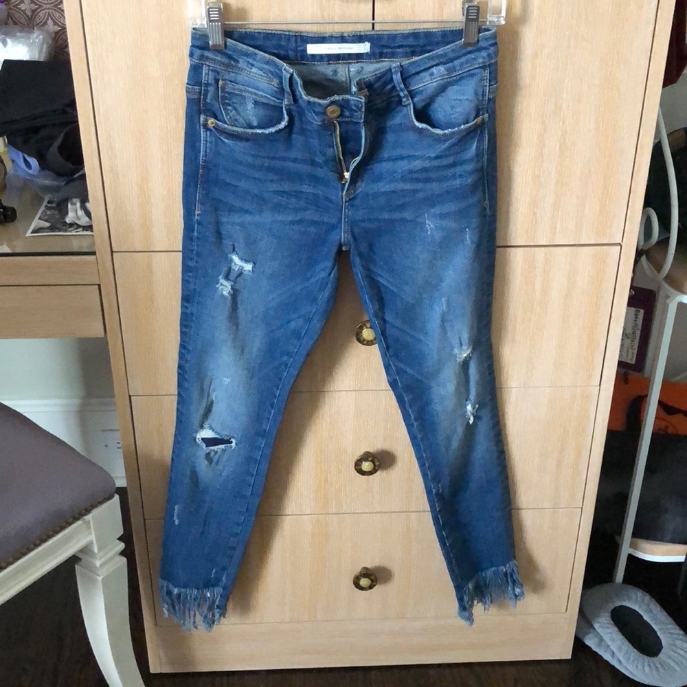 RIPPED JEANS WITH FLARE AT BOTTOM